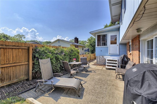 2 Redgrave Dr, Hempfield Twp, PA 15601 - fenced backyard with grilling area and a patio