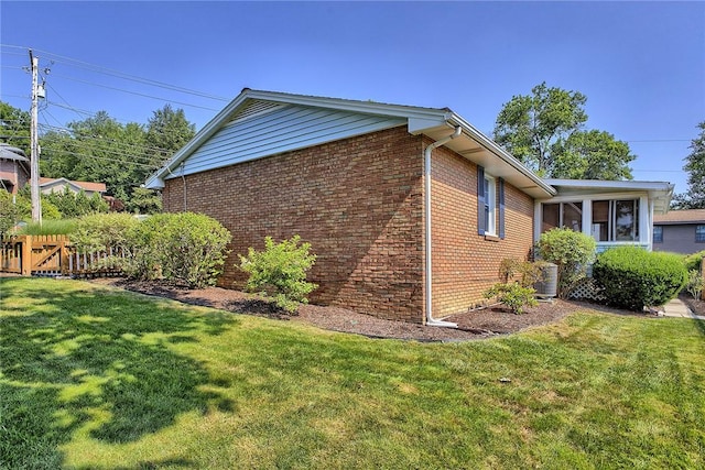 2 Redgrave Dr, Hempfield Twp, PA 15601 - view of side of home with brick siding and a sunroom