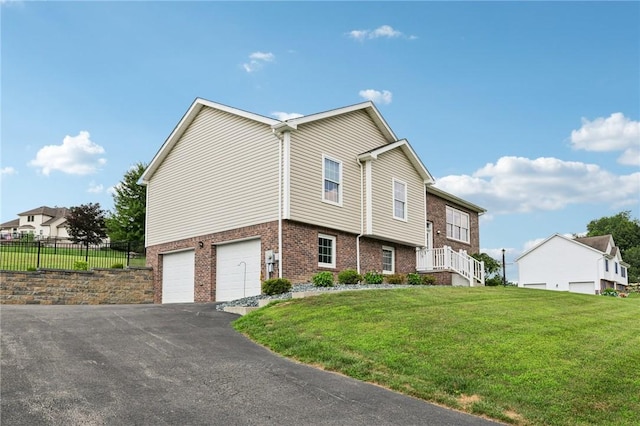 196 Weathervane Dr, Slippery Rock Twp, PA 16057 - view of front facade featuring an attached garage, asphalt driveway, and brick siding