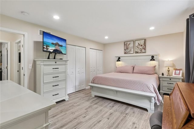 196 Weathervane Dr, Slippery Rock Twp, PA 16057 - bedroom featuring two closets, light wood-style flooring, and recessed lighting
