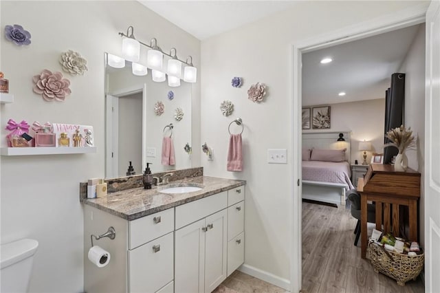 196 Weathervane Dr, Slippery Rock Twp, PA 16057 - ensuite bathroom with vanity, recessed lighting, and wood finished floors
