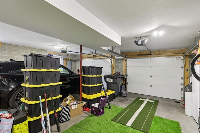 196 Weathervane Dr, Slippery Rock Twp, PA 16057 - garage featuring concrete block wall, a garage door opener, and electric panel