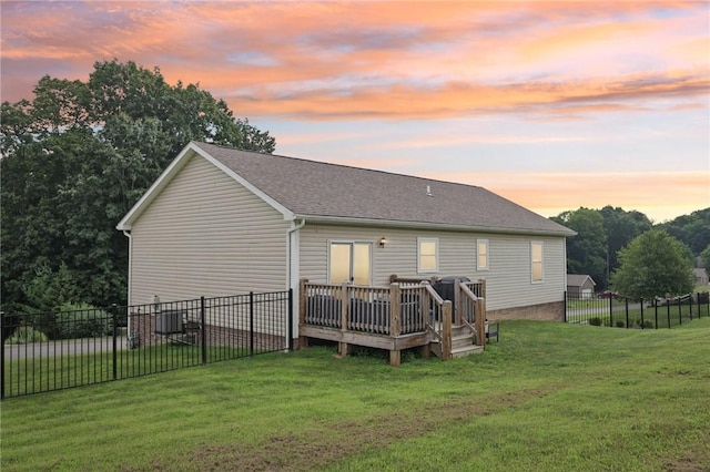 196 Weathervane Dr, Slippery Rock Twp, PA 16057 - back of property at dusk featuring a deck, a fenced backyard, and a shingled roof