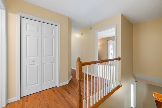 113 Great Rock Dr, Bethel Park, PA 15102 - hall featuring an upstairs landing and light wood-style floors