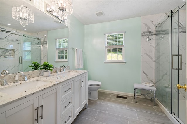 113 Great Rock Dr, Bethel Park, PA 15102 - bathroom featuring a chandelier, double vanity, a marble finish shower, and a textured ceiling