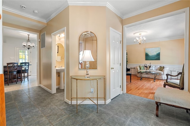113 Great Rock Dr, Bethel Park, PA 15102 - hallway with a chandelier, ornamental molding, and dark tile patterned flooring
