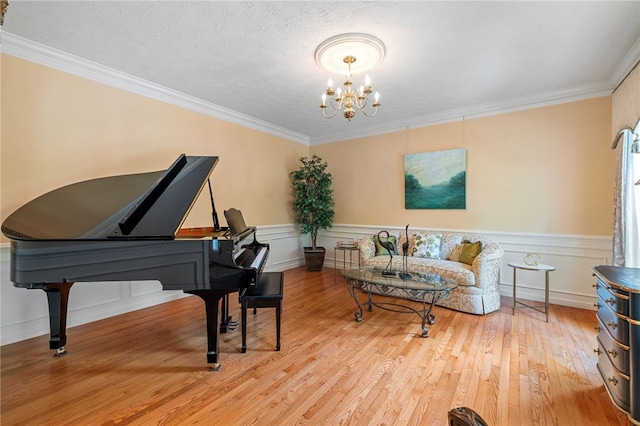 113 Great Rock Dr, Bethel Park, PA 15102 - living area featuring a chandelier, ornamental molding, wood finished floors, and wainscoting