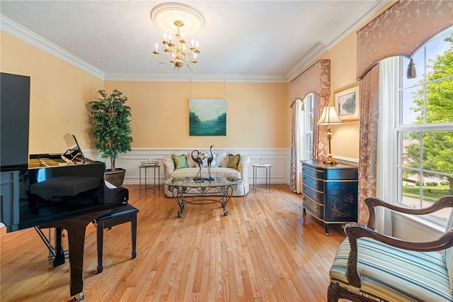 113 Great Rock Dr, Bethel Park, PA 15102 - sitting room featuring healthy amount of natural light, a chandelier, hardwood / wood-style floors, crown molding, and wainscoting