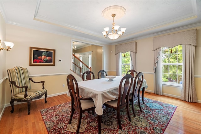 113 Great Rock Dr, Bethel Park, PA 15102 - dining area with a chandelier, ornamental molding, a raised ceiling, light wood-type flooring, and stairway