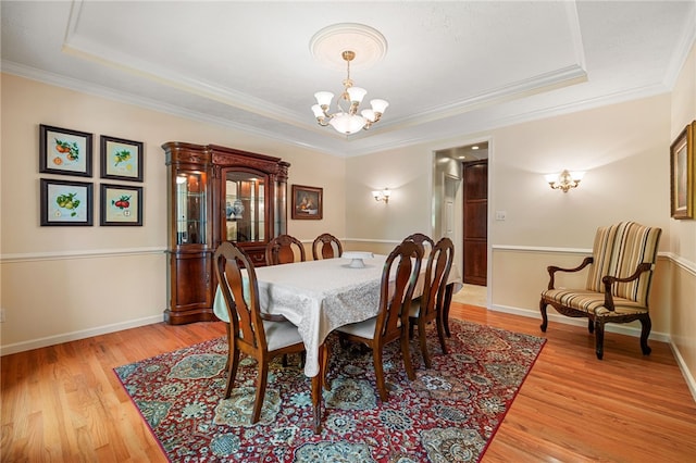 113 Great Rock Dr, Bethel Park, PA 15102 - dining area with a chandelier, light wood-type flooring, a raised ceiling, and crown molding