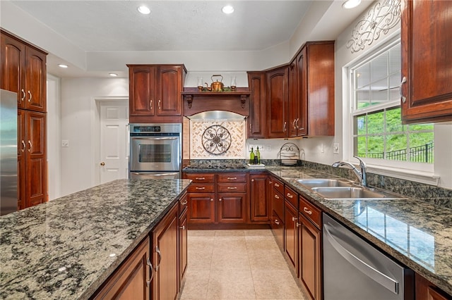 113 Great Rock Dr, Bethel Park, PA 15102 - kitchen featuring stainless steel appliances, recessed lighting, custom range hood, dark stone counters, and light tile patterned floors