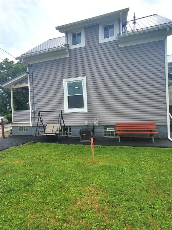 413 River Ave, Aliquippa, PA 15001 - back of property with a lawn and a metal roof