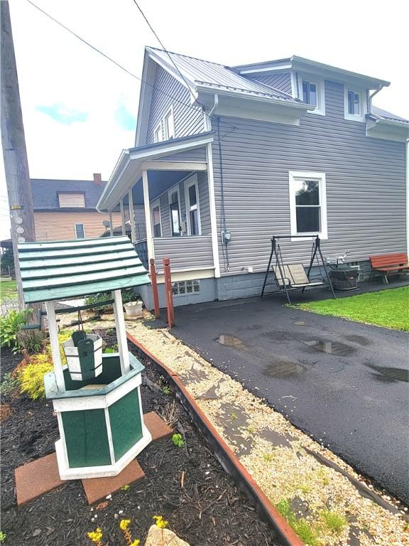 413 River Ave, Aliquippa, PA 15001 - rear view of property with a metal roof and a porch