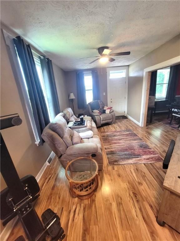 413 River Ave, Aliquippa, PA 15001 - living room with ceiling fan, a textured ceiling, and wood finished floors