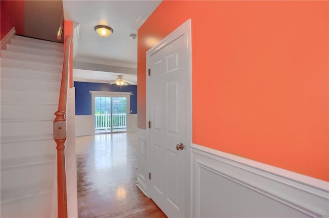 184 Wynne St, Shaler, PA 15209 - corridor featuring crown molding, a wainscoted wall, wood finished floors, and stairs