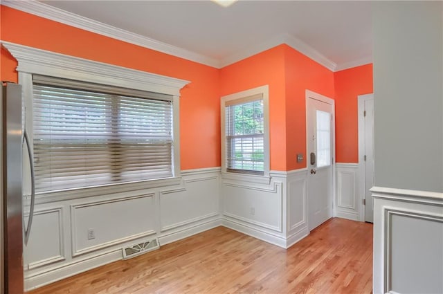 184 Wynne St, Shaler, PA 15209 - spare room featuring light wood finished floors, wainscoting, and crown molding