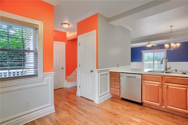 184 Wynne St, Shaler, PA 15209 - kitchen with stainless steel dishwasher, crown molding, a wainscoted wall, light wood-type flooring, and light countertops