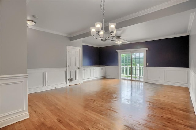 184 Wynne St, Shaler, PA 15209 - unfurnished dining area with a chandelier, ornamental molding, wood finished floors, a decorative wall, and a wainscoted wall