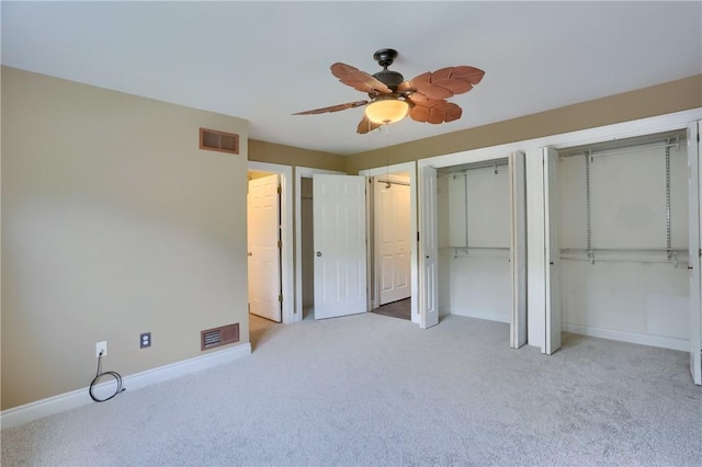 184 Wynne St, Shaler, PA 15209 - unfurnished bedroom featuring carpet floors, two closets, and a ceiling fan