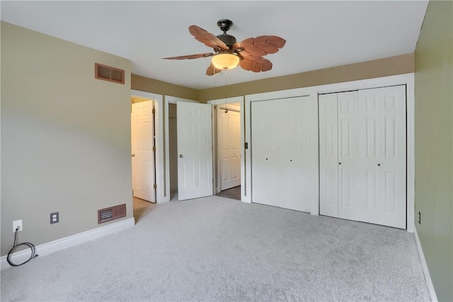 184 Wynne St, Shaler, PA 15209 - unfurnished bedroom featuring carpet, two closets, and ceiling fan