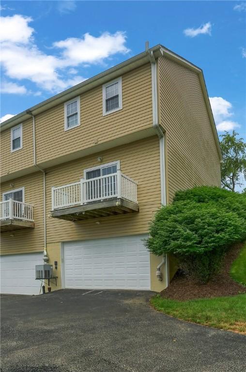 184 Wynne St, Shaler, PA 15209 - back of house with an attached garage and asphalt driveway