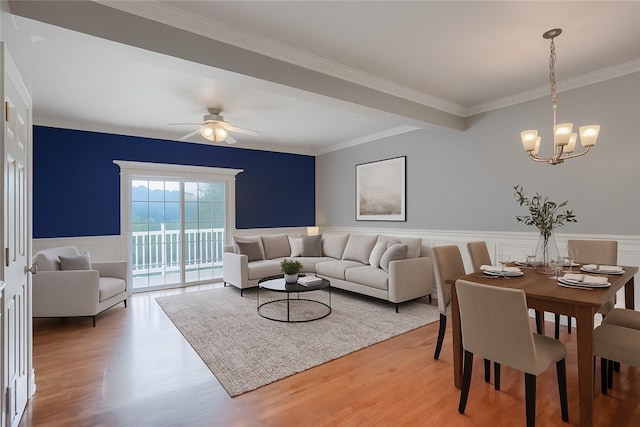 184 Wynne St, Shaler, PA 15209 - living area featuring a chandelier, light wood finished floors, wainscoting, a ceiling fan, and crown molding