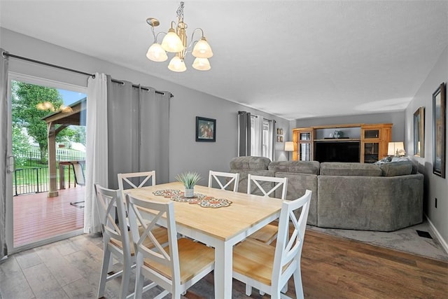 53 Peters Rd, Hempfield Twp, PA 15601 - dining room featuring wood finished floors and a chandelier