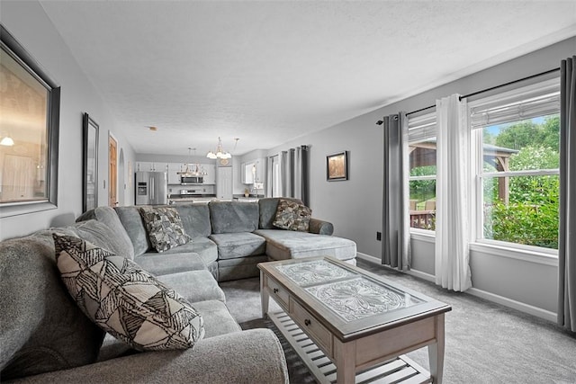 53 Peters Rd, Hempfield Twp, PA 15601 - living room featuring a chandelier, light colored carpet, and a textured ceiling