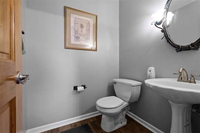53 Peters Rd, Hempfield Twp, PA 15601 - bathroom featuring toilet and wood finished floors