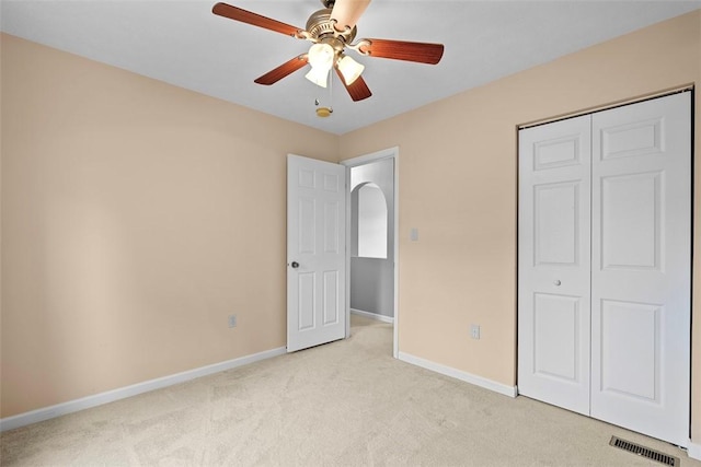 53 Peters Rd, Hempfield Twp, PA 15601 - unfurnished bedroom featuring light carpet, a closet, ceiling fan, and arched walkways