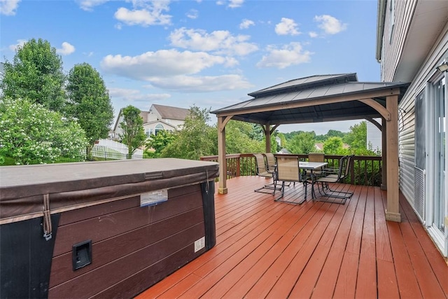 53 Peters Rd, Hempfield Twp, PA 15601 - wooden deck featuring a gazebo, a hot tub, and outdoor dining space
