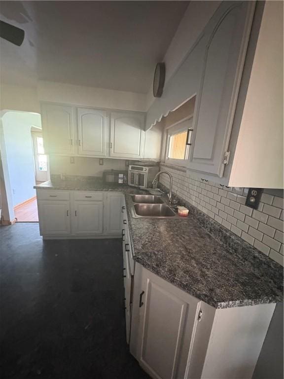 13 Kepple St, Penn Twp, PA 15644 - kitchen featuring white cabinetry and tasteful backsplash