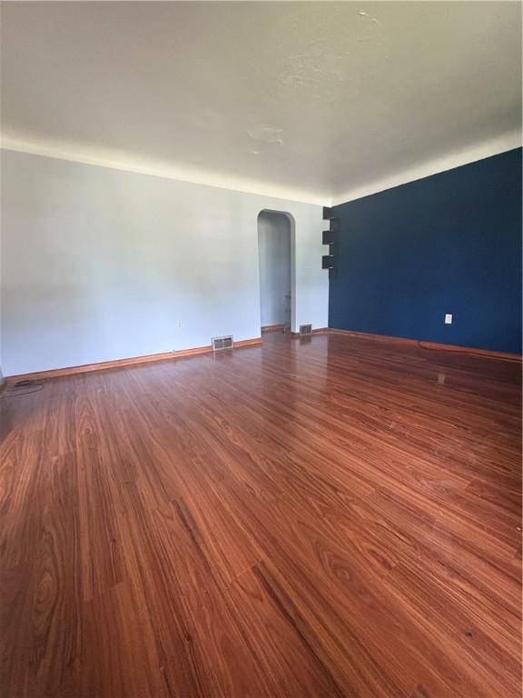 13 Kepple St, Penn Twp, PA 15644 - spare room with arched walkways and wood finished floors