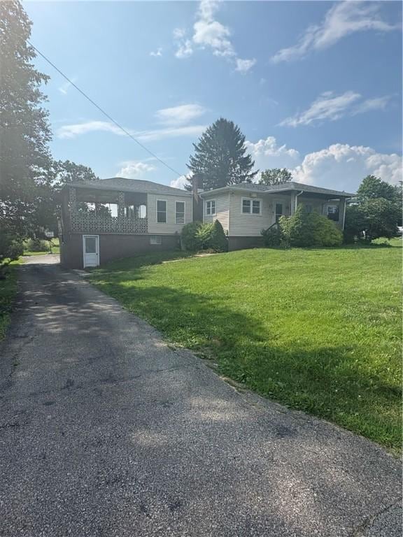 13 Kepple St, Penn Twp, PA 15644 - view of front of house featuring asphalt driveway and a front lawn