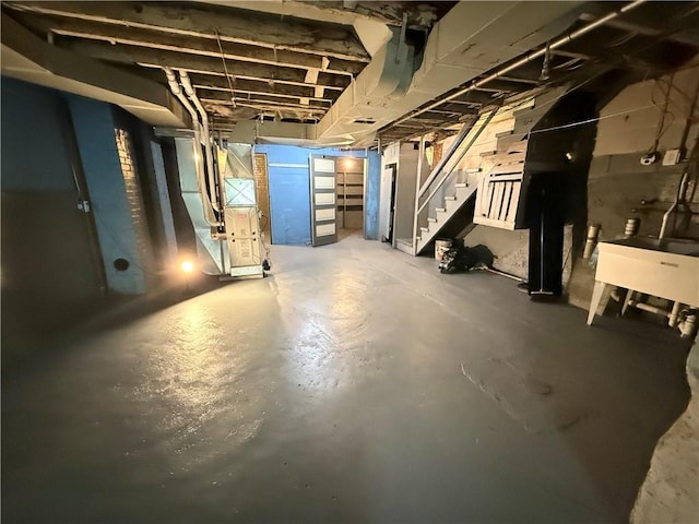 149 N 3rd St, Duquesne, PA 15110 - unfinished basement featuring stairs and heating unit