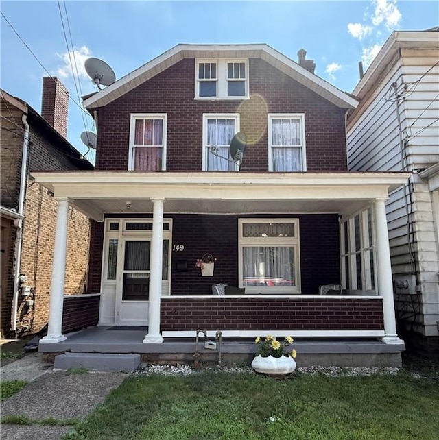 149 N 3rd St, Duquesne, PA 15110 - view of front facade with a porch and brick siding