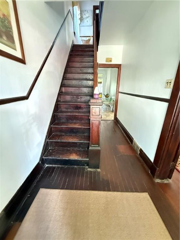 149 N 3rd St, Duquesne, PA 15110 - staircase with hardwood / wood-style flooring and baseboards