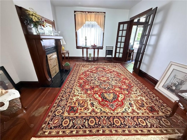 149 N 3rd St, Duquesne, PA 15110 - foyer featuring dark wood-type flooring, a fireplace with flush hearth, and plenty of natural light