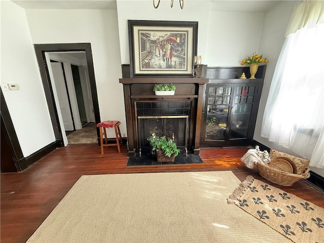 149 N 3rd St, Duquesne, PA 15110 - living room with wood finished floors and a tiled fireplace