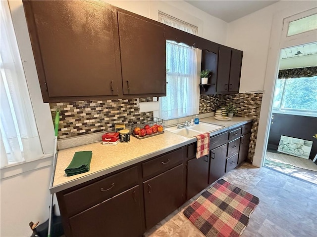 149 N 3rd St, Duquesne, PA 15110 - kitchen featuring light countertops, tasteful backsplash, and dark brown cabinetry