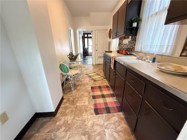 149 N 3rd St, Duquesne, PA 15110 - kitchen with tasteful backsplash, dark brown cabinetry, light countertops, and open shelves