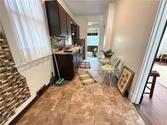 149 N 3rd St, Duquesne, PA 15110 - kitchen with light countertops and decorative backsplash