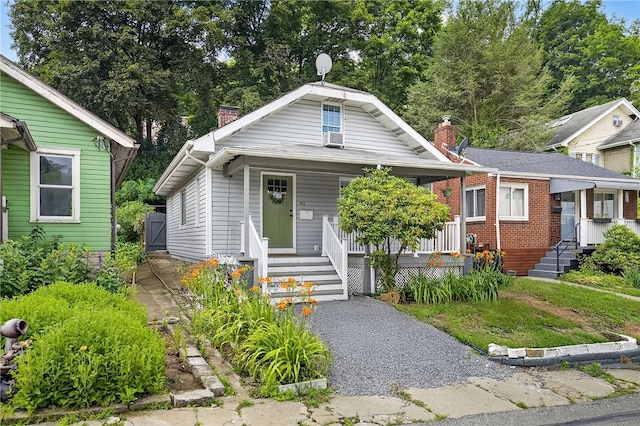 411 Center Ave, West View, PA 15229 - bungalow-style home featuring a chimney and a porch
