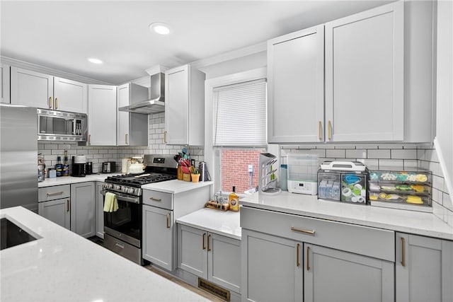 411 Center Ave, West View, PA 15229 - kitchen with stainless steel appliances, wall chimney range hood, gray cabinetry, tasteful backsplash, and recessed lighting
