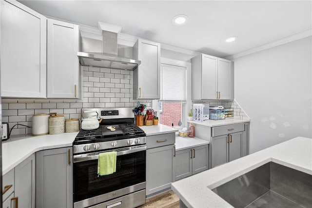 411 Center Ave, West View, PA 15229 - kitchen with stainless steel range with gas cooktop, wall chimney exhaust hood, gray cabinets, tasteful backsplash, and crown molding