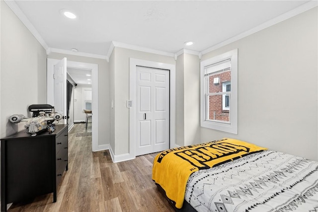 411 Center Ave, West View, PA 15229 - bedroom with wood finished floors, crown molding, recessed lighting, and a closet