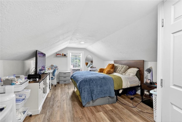 411 Center Ave, West View, PA 15229 - bedroom featuring a textured ceiling, light wood-style floors, and vaulted ceiling
