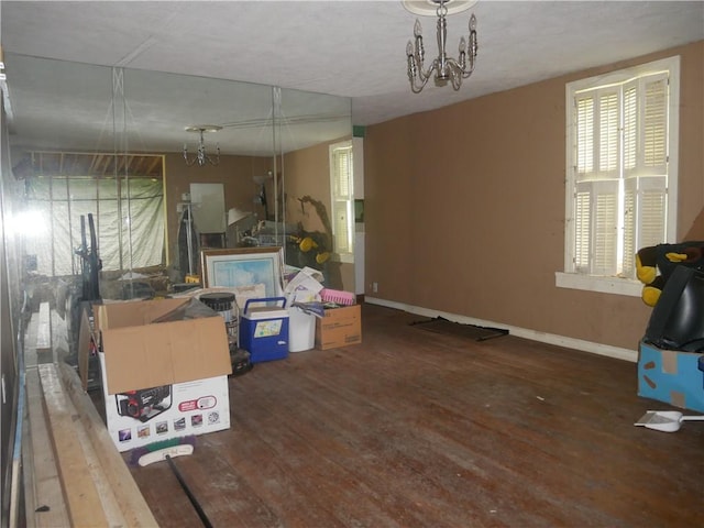 234 Simon Aly, Duquesne, PA 15110 - below grade area featuring wood-type flooring and a chandelier