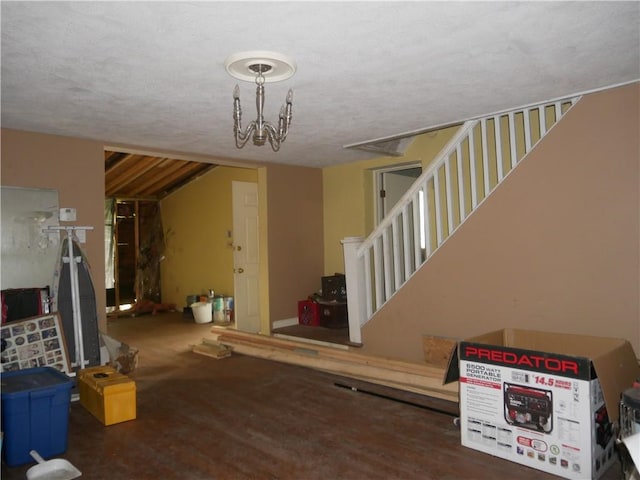 234 Simon Aly, Duquesne, PA 15110 - basement featuring stairs, a textured ceiling, and wood finished floors