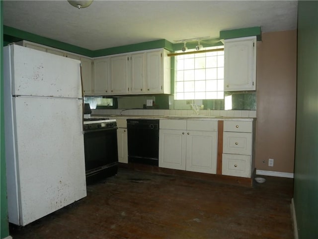 234 Simon Aly, Duquesne, PA 15110 - kitchen featuring freestanding refrigerator, black dishwasher, range with gas stovetop, white cabinets, and tile counters